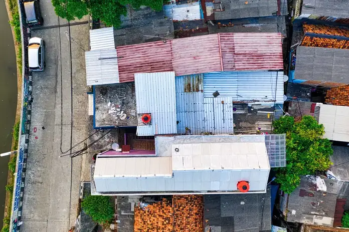 Aerial view of sheds and outbuildings with corrugated sheet roofs