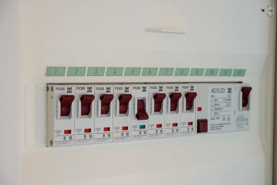 Row of circuit breakers in a consumer unit, where you switch off a circuit if roof leak water is near lights or wiring