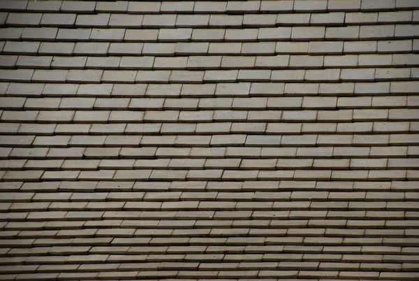 Neat slate roof laid in straight, even courses
