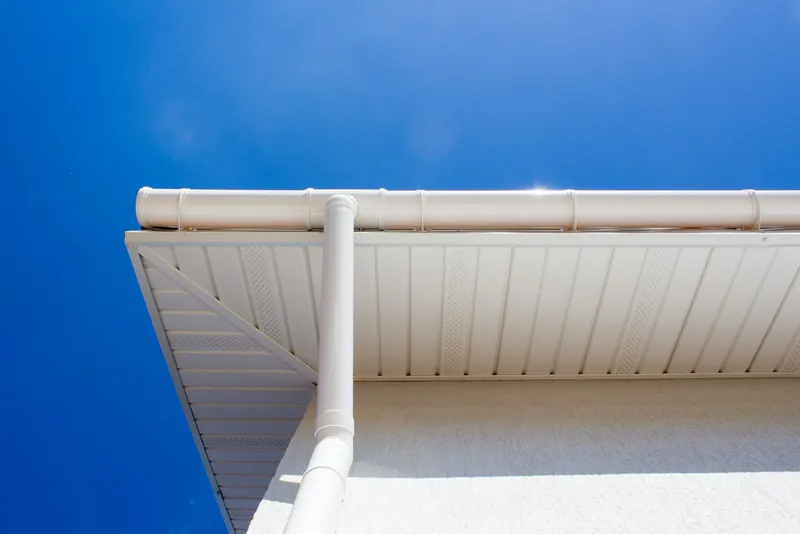 New white uPVC gutter, fascia and soffit on the eaves of a house