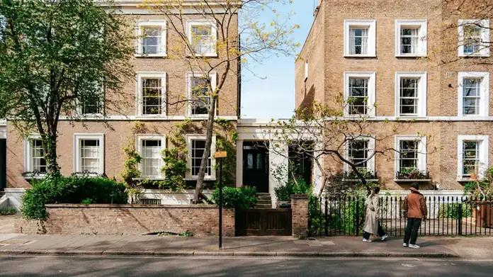 Georgian brick terraced houses with sash windows along a tree-lined street