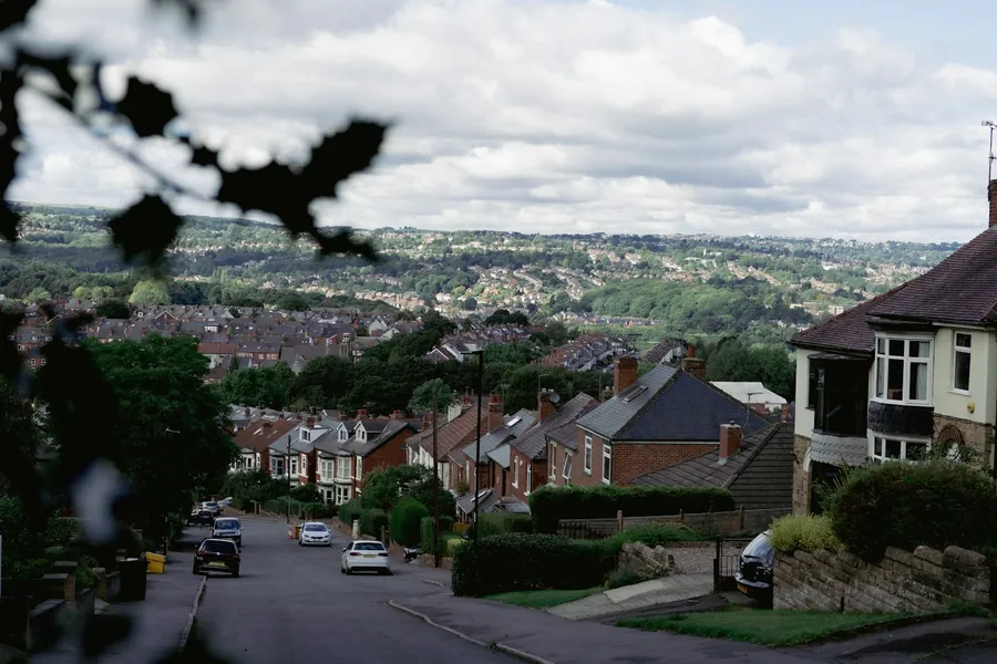 Suburban street of semi-detached houses on a hillside