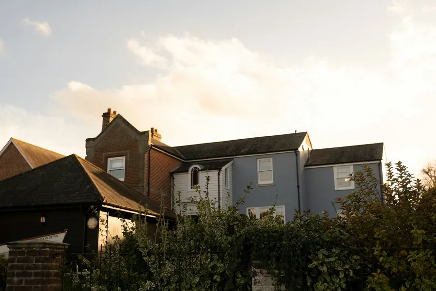 Houses with gabled roofs in low evening light