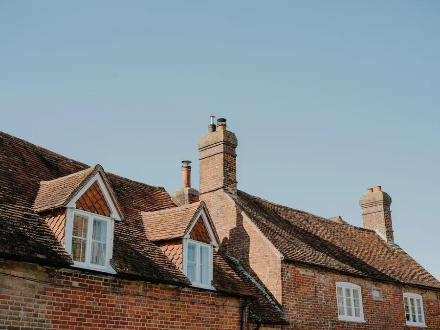 Brick houses with tiled dormers and chimney stacks